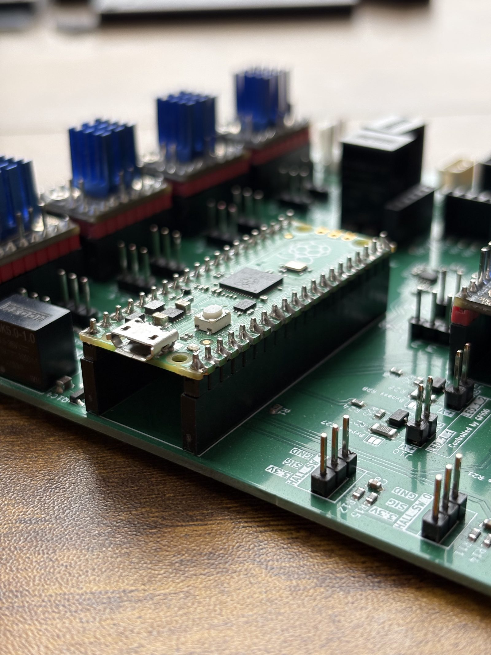 The Raspberry Pi Pico fully seated in its sockets on the control board, sitting flat and parallel to the board