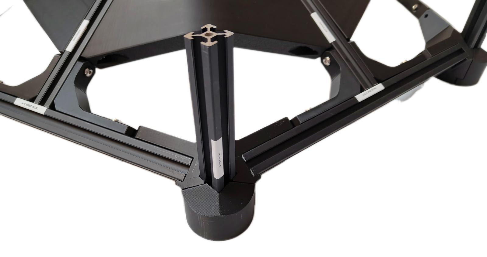 A corner with piece C vertical extrusion held between the External bracket — cover and the External bracket — side, seen from below