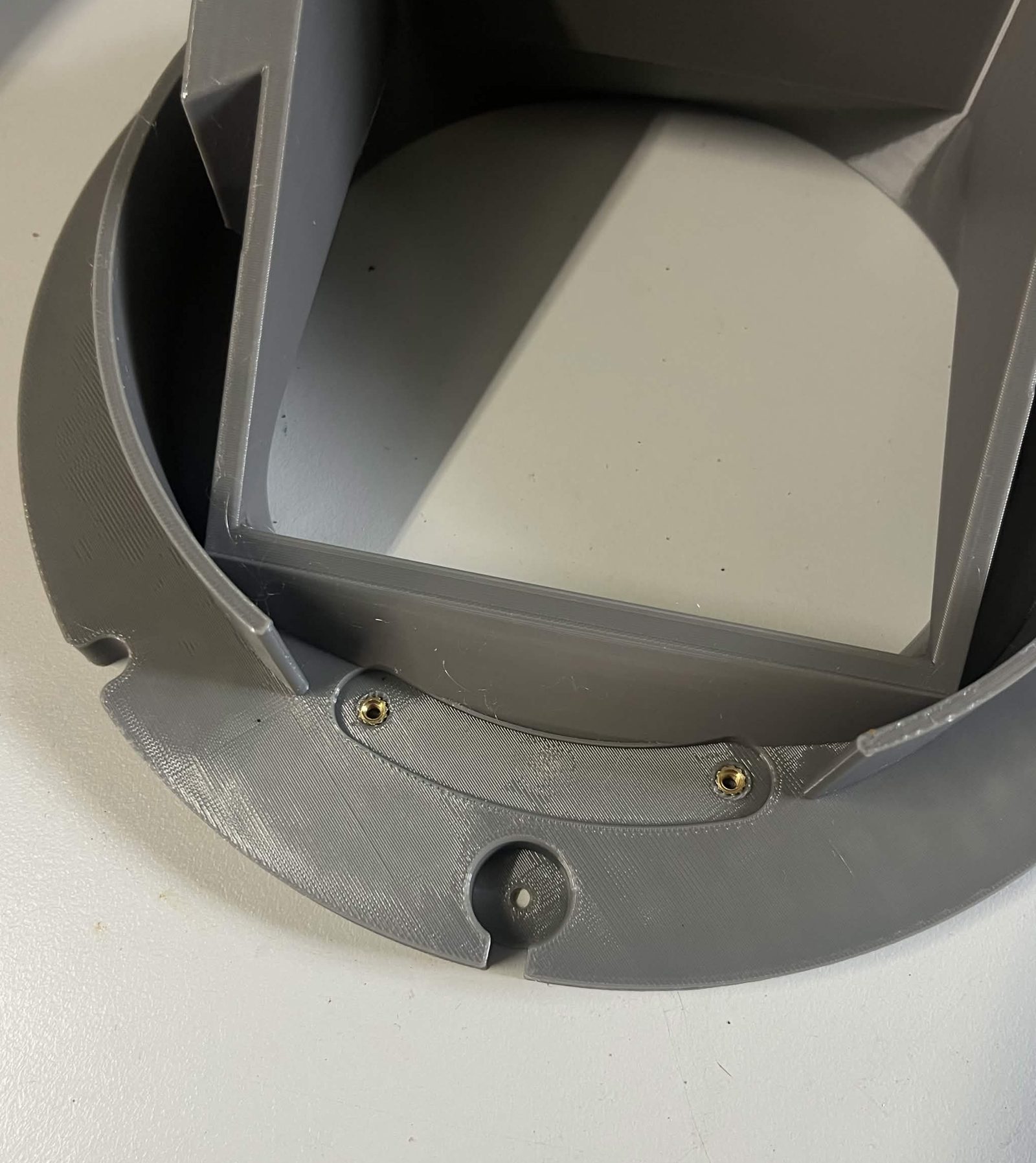 A closer grey view of the Top interface chute mount underside, showing two of the M3 inserts on the ring beside the recess for the Limit switch hammer screw