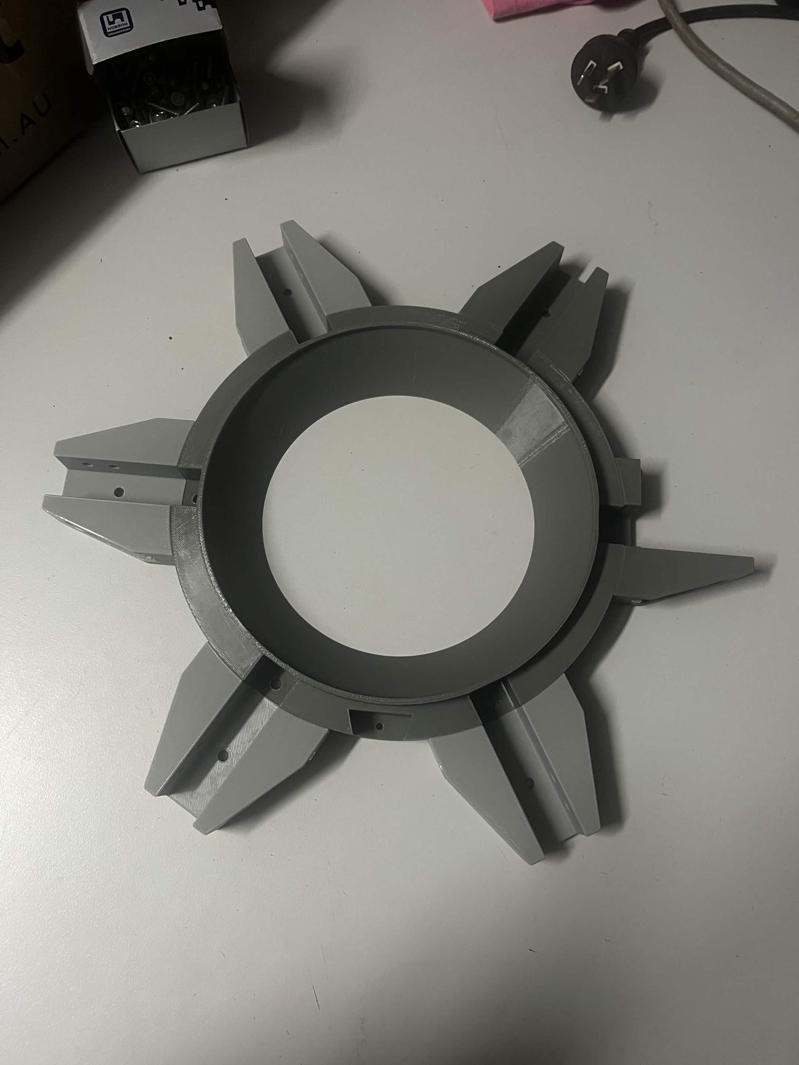 Six grey Interface ribs attached around the circular Interface upper fixed section