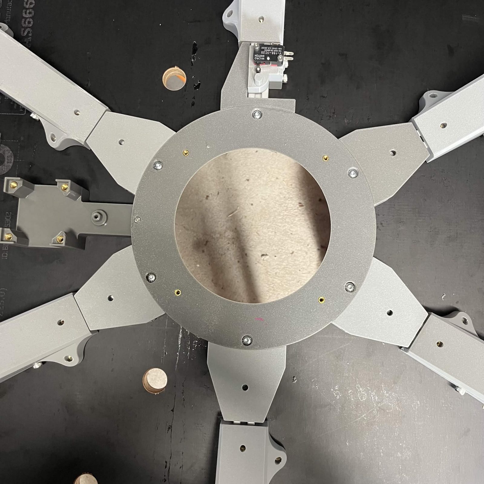 All six Interface brackets and their extrusions installed around the Interface upper fixed section, seen from above, with the limit switch bracket among them