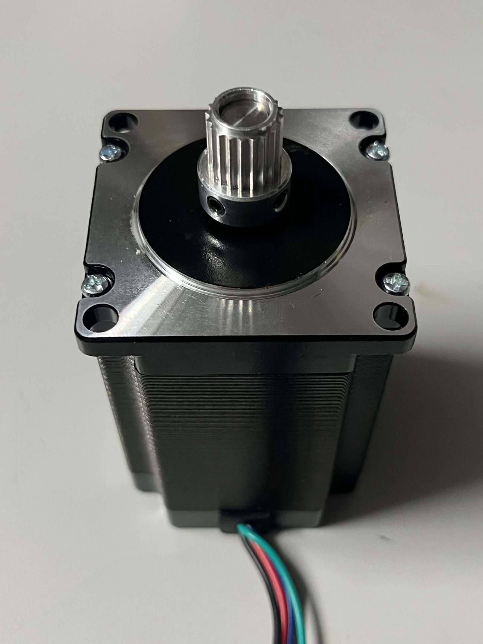 Timing pulley installed on the shaft of a NEMA 23 stepper motor