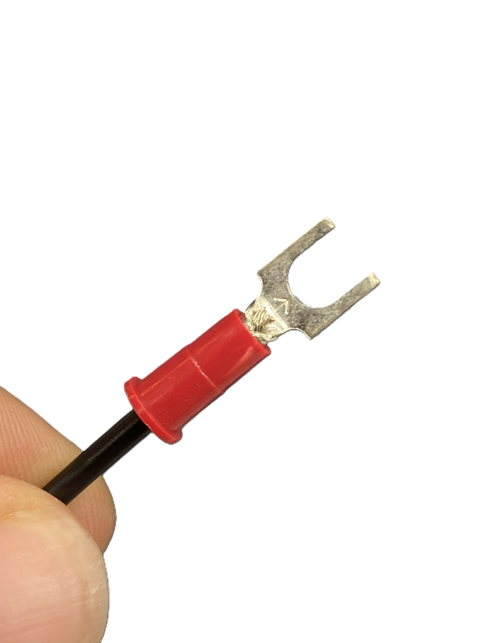 Stripped wire seated in the fork terminal barrel, not yet crimped