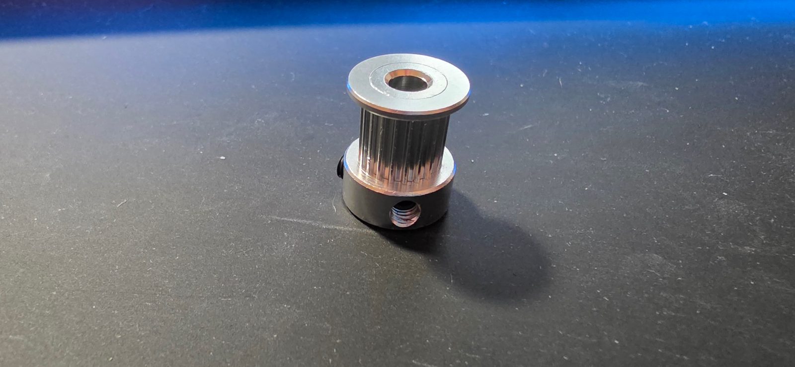 20-tooth timing pulley before preparation, with the top flange attached