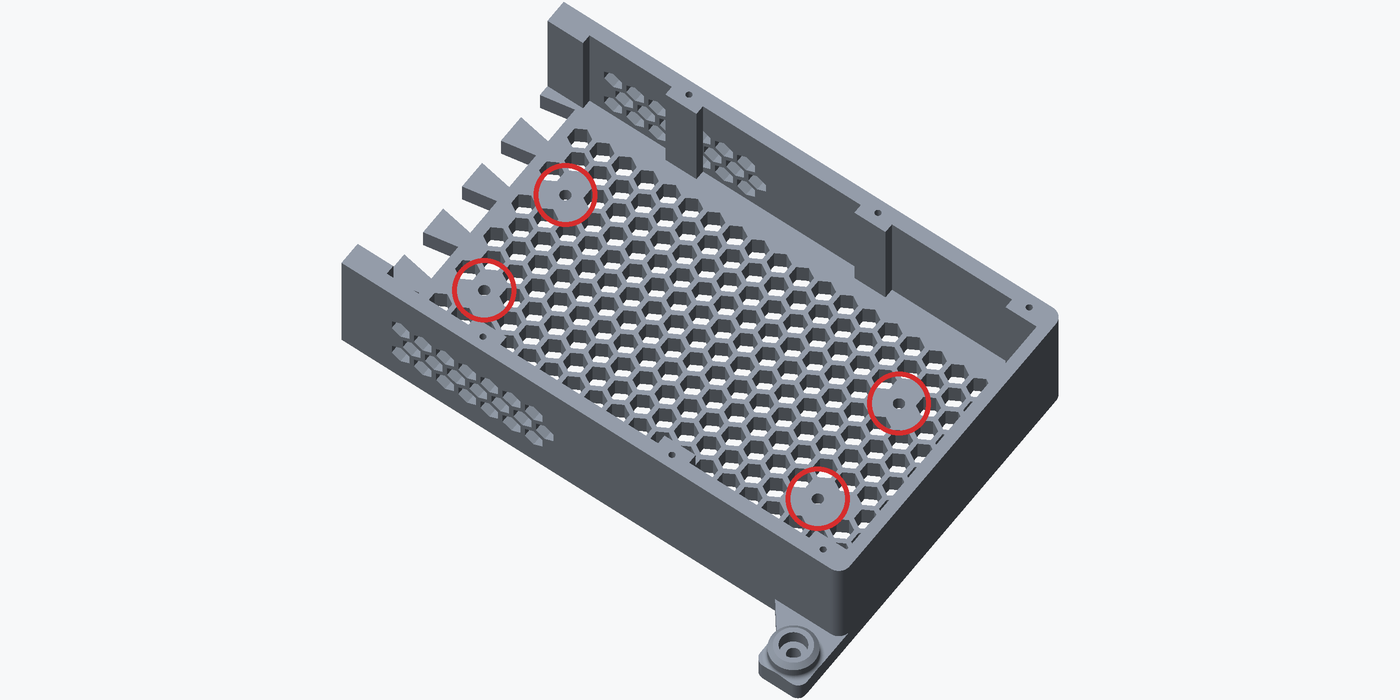 Render of the shell rear tray seen from above and to one side, its honeycomb floor and vented walls visible, with the four round clearance holes the M4 screws pass through ringed