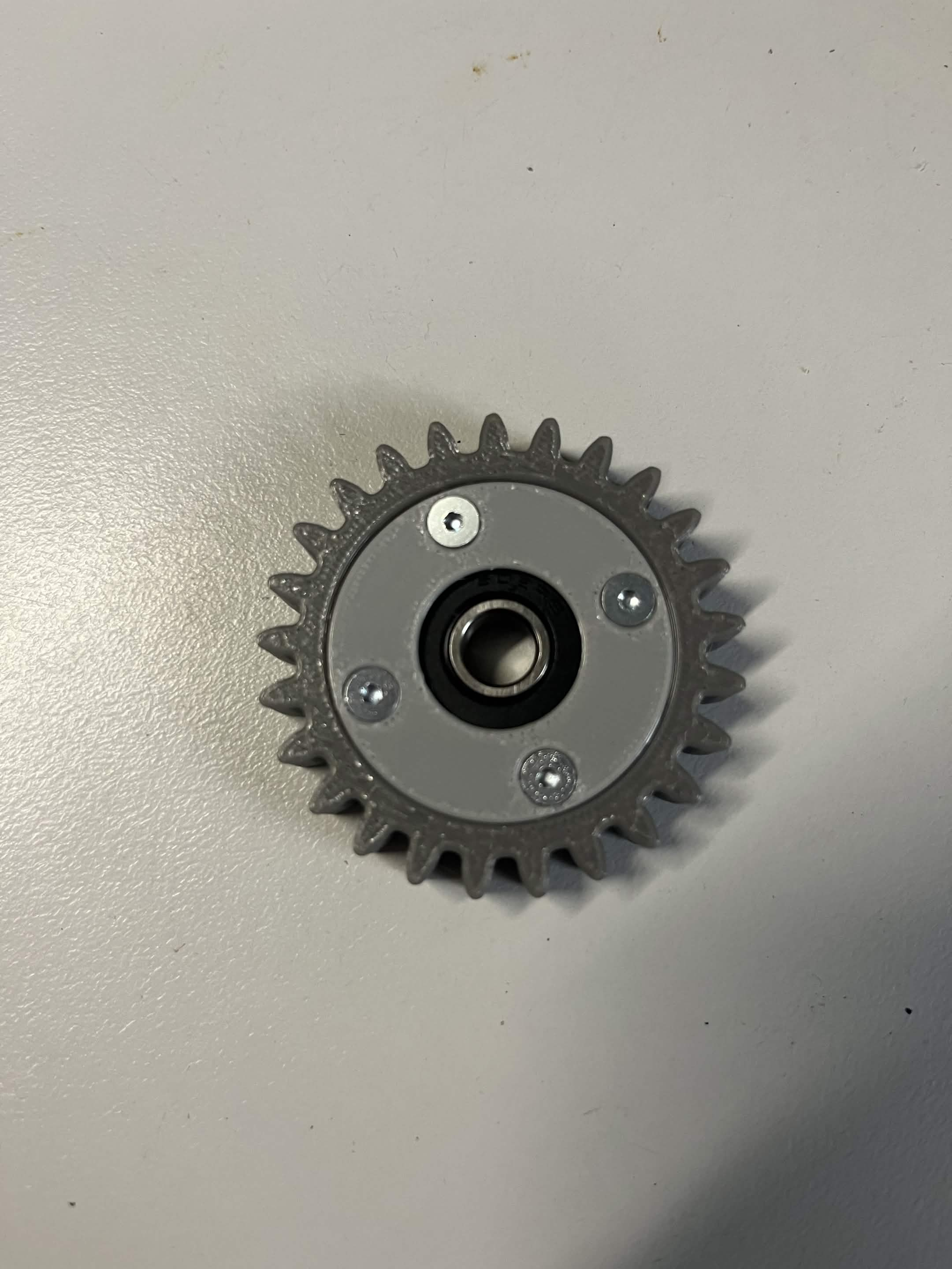 The Interface idler gear with the bearing retainer caps mounted for real, the 4 screws seated flush in place of the heat inserts