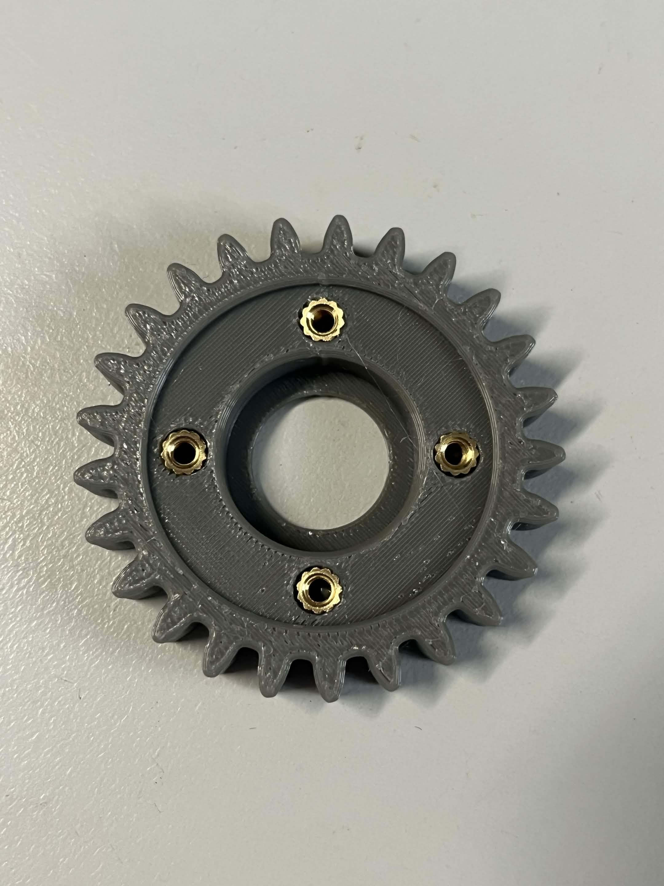 The Interface idler gear alone, showing all 4 brass M3 heat inserts around the bearing pocket