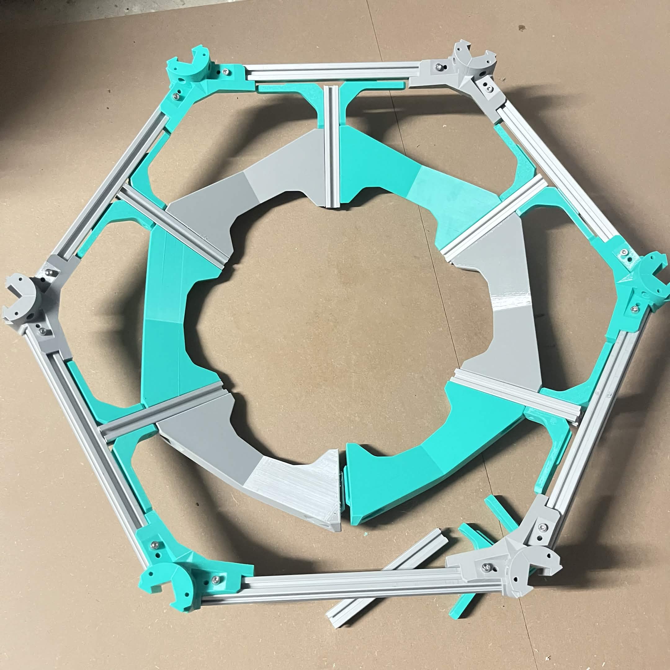 The outer aluminum hexagon ring from step 1 dropped over the spoke assembly, mostly seated with one corner still proud