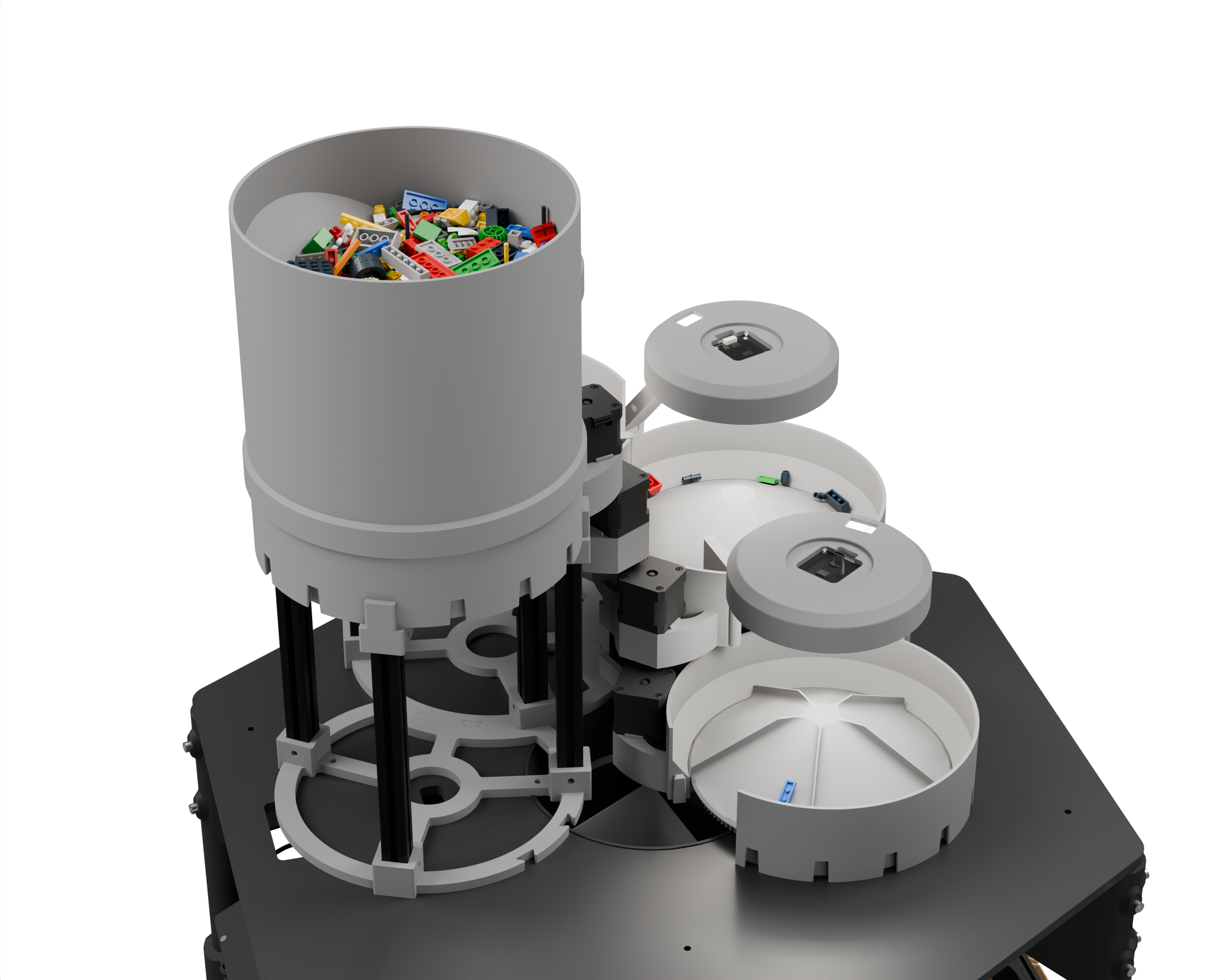 The bucket full of LEGO pieces beside the rotary feeders